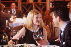 A couple dining in a restaurant; Actual size=240 pixels wide